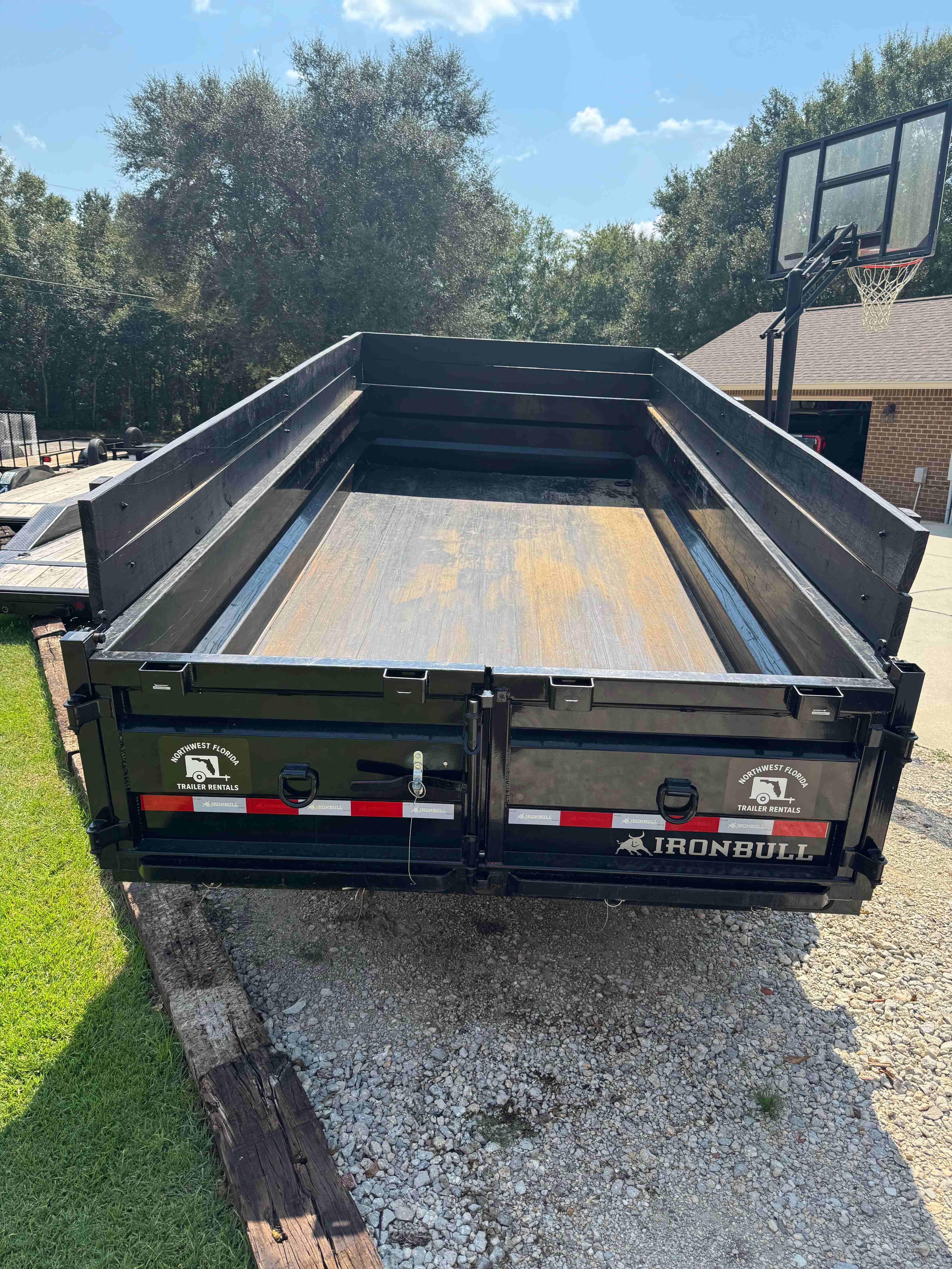 Ironbull 7x16 Dump Trailer - Rear View with tailgate open showing 16x7 foot dump bed capacity